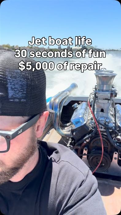Running a big-block jet boat under load on open water, blower and headers visible.