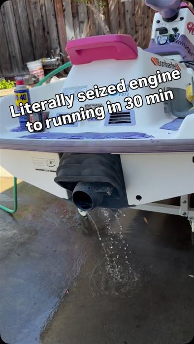 Water draining from the exhaust of a Bombardier personal watercraft after a seized engine was freed.